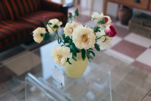 Fresh flowers on a glass table in the cafe at Stretch & Fold